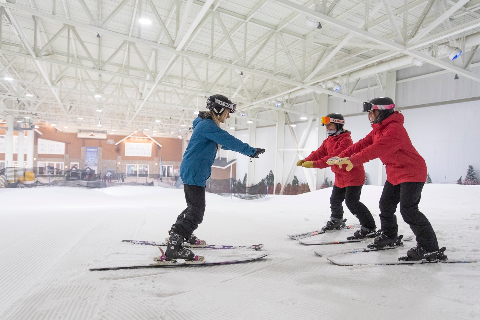 Students taking a ski lesson at Big Snow American Dream indoor ski resort in New Jersey