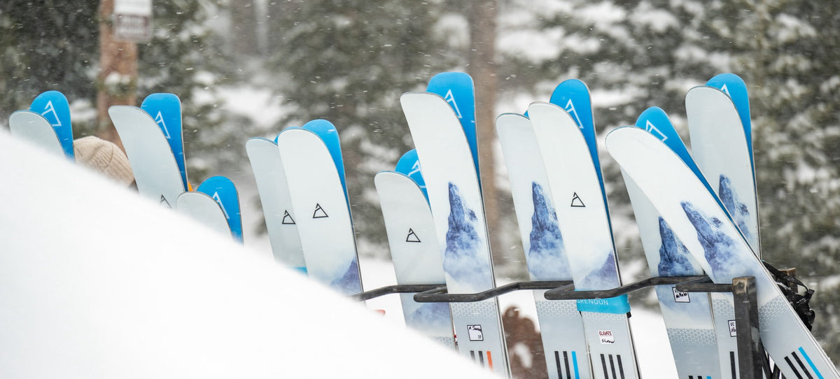 Renoun Citadel skis in various sizes on a ski rack in Crested Butte, CO